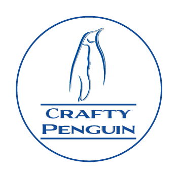 Outline of an emperor penguin in dark blue stroke with silver shadow, below in between two dark blue lines read's the words Crafty Penguin all inside a dark blue stroke circle with a white background.